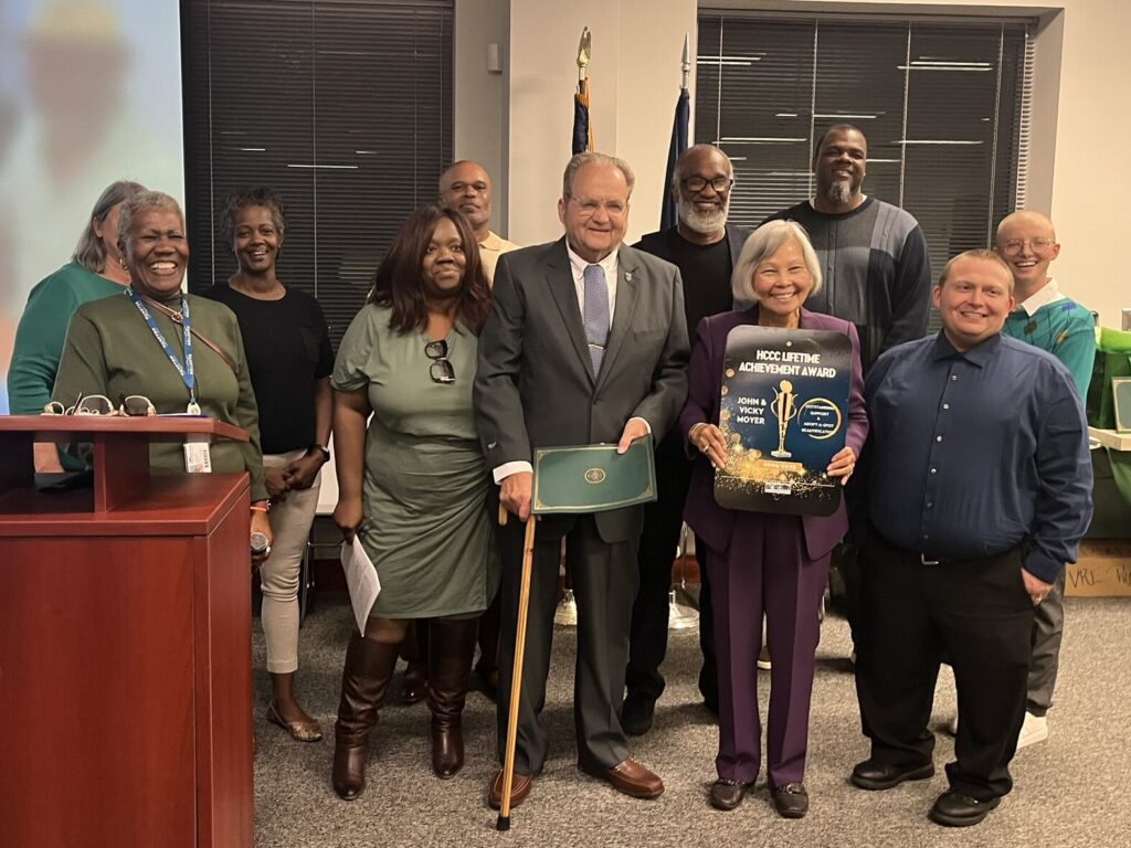 Standing with several members of the Hampton Clean City Commission, John and Vicky Moyer hold the Lifetime Achievement Award they received in October 2025.